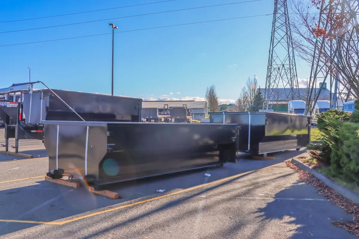 Roll-off dumpster ready for waste disposal at job site for 30 Yard Dumpster Rental in Falls